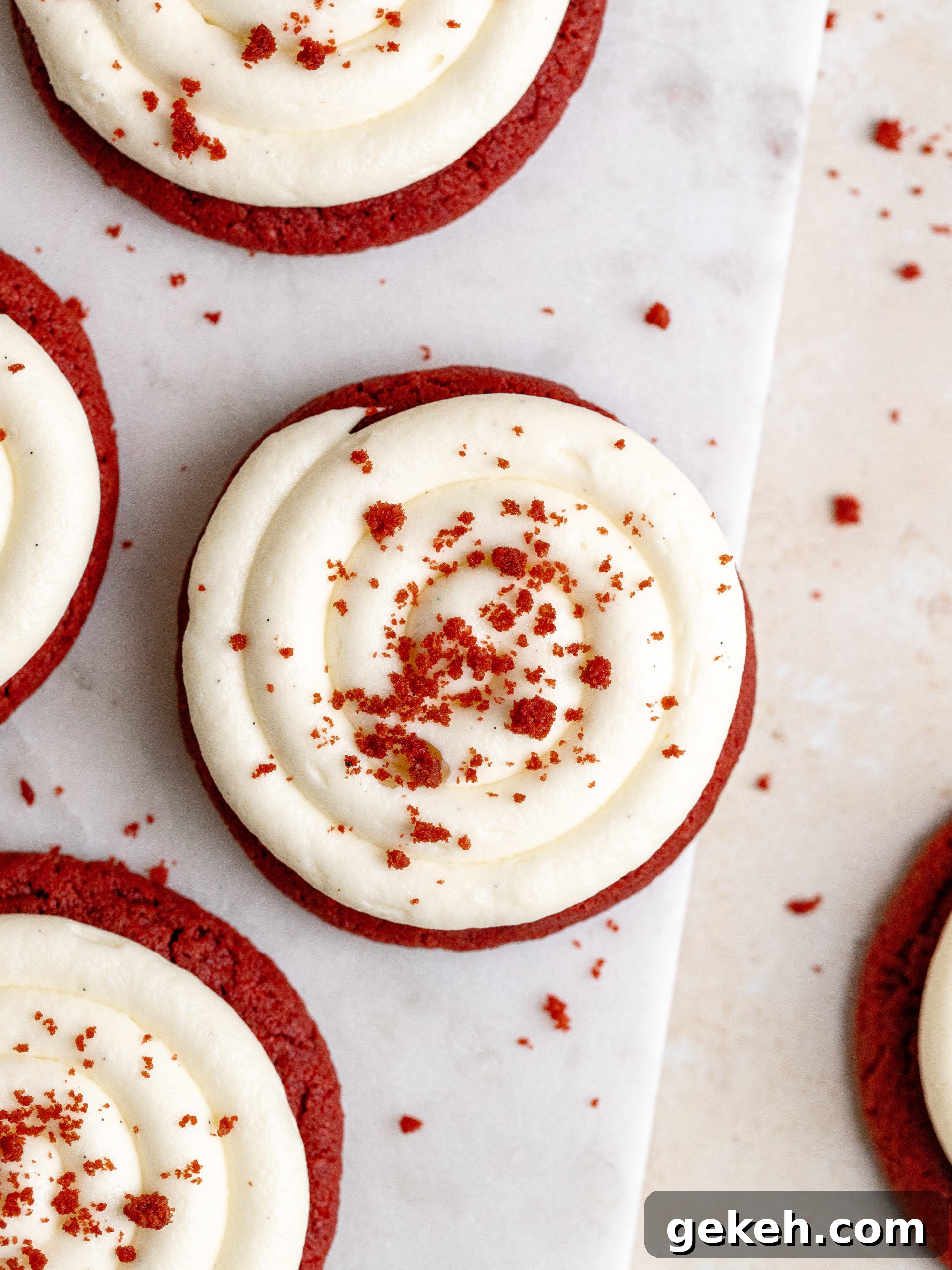 Stack of red velvet cookies with frosting