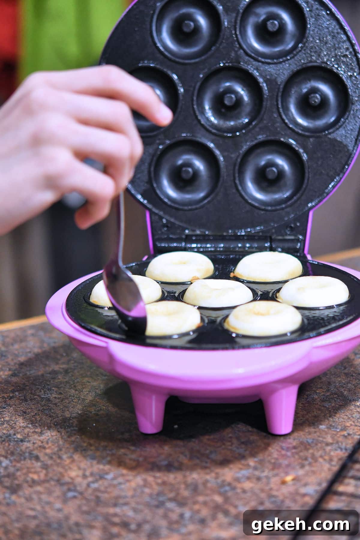 electric brentwood donut maker with fresh baked donuts.