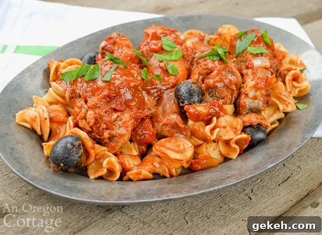 Chicken with olives-artichokes on pewter plate
