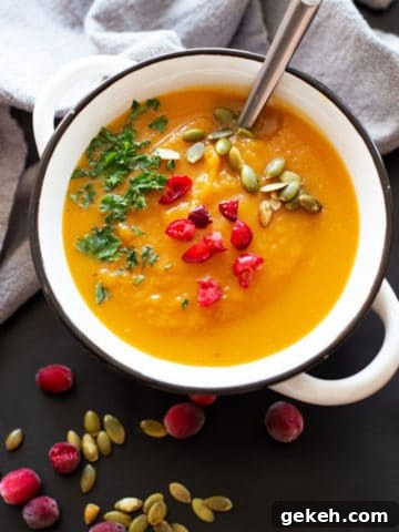 White bowl containing Spiced Butternut Squash Soup.