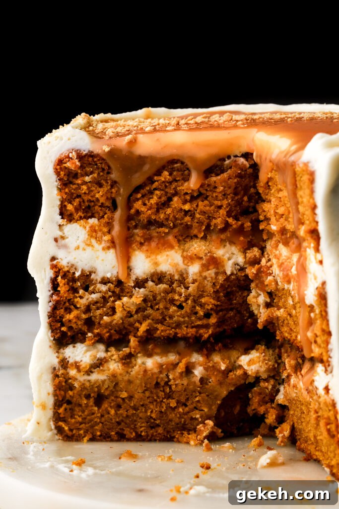 close up of pumpkin cake with caramel dripping down