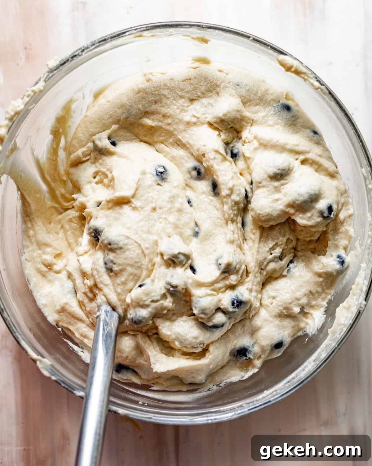 Moist Lemon Blueberry Pound Cake Recipe 6 lemon blueberry pound cake batter in a mixing bowl with a rubber spatula.