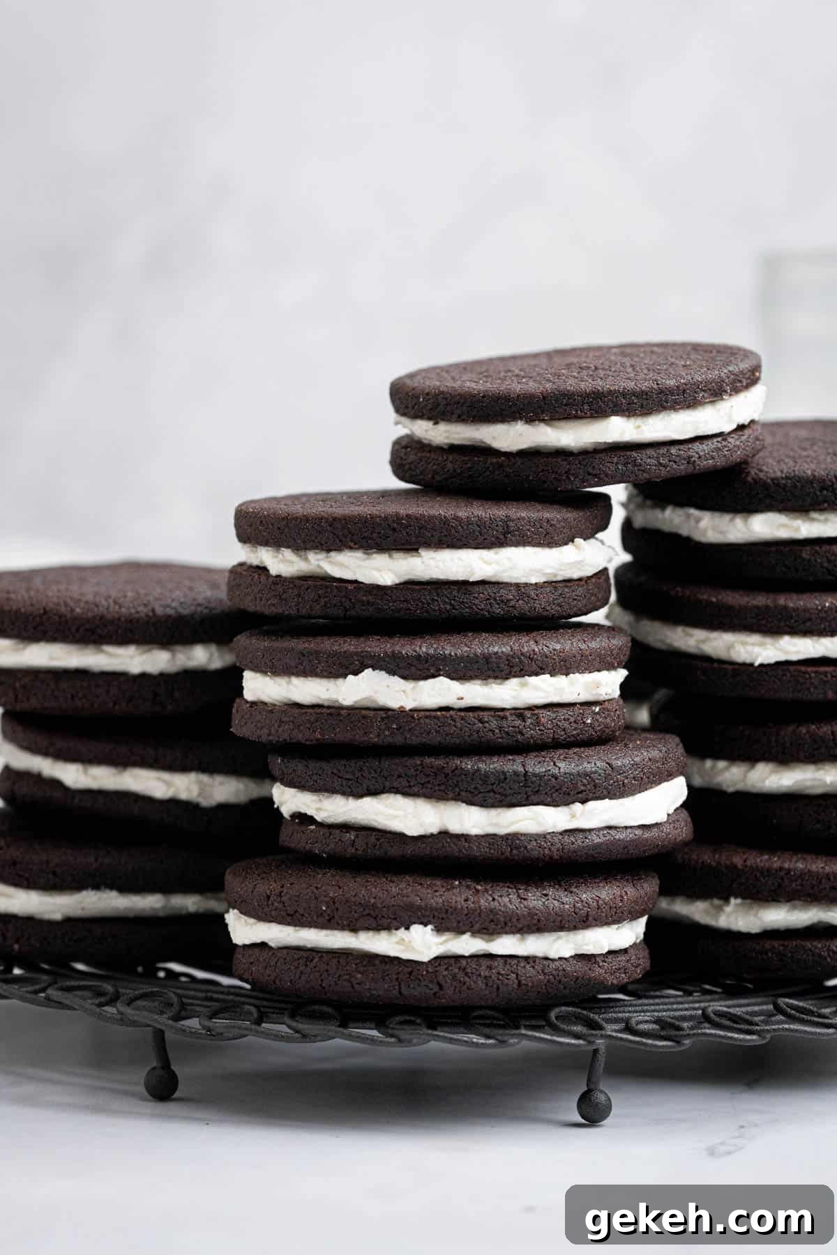 Vegan Mint Chocolate Sandwich Cookies Recipe 11 Stacks of vegan mint chocolate sandwich cookies on a wire rack.