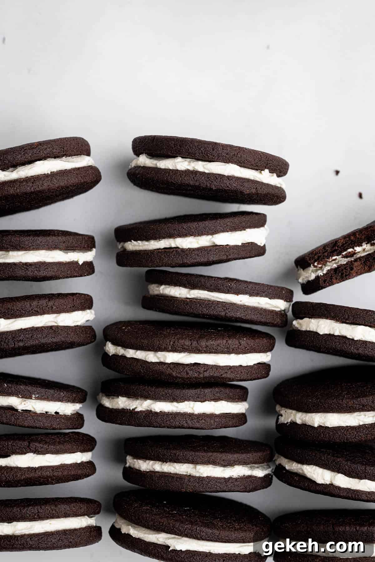 Vegan Mint Chocolate Sandwich Cookies Recipe 13 Rows of vegan mint chocolate sandwich cookies on their sides.