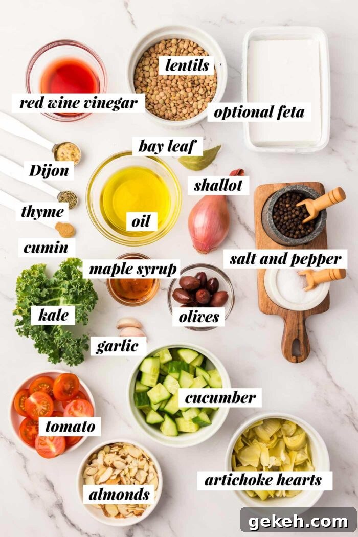 Protein-Packed Lentil and Kale Salad with Lemon Tahini Dressing 3 All of the ingredients gathered for making a vegan lentil kale salad with dijon dressing, artichokes, cucumber, tomato and almond. Each ingredient is labelled with text overlay.