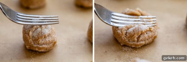 Chewy Peanut Butter Cookie Recipe That Melts in Your Mouth 11 pressing a peanut butter cookie with a fork for peanut butter cookies recipe.