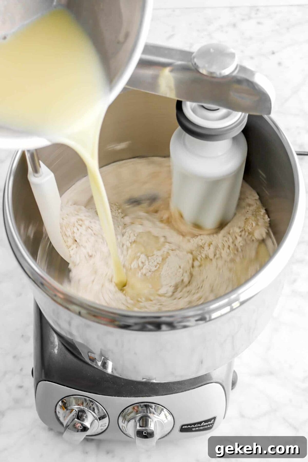 butter and milk mixture being poured into dry ingredients