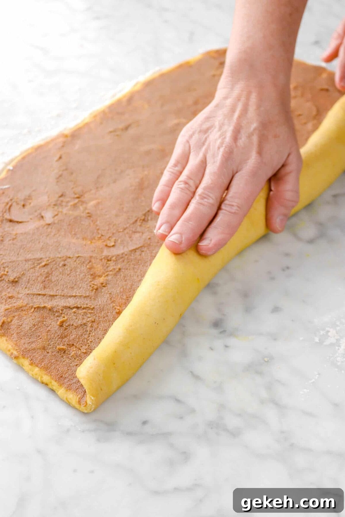 pumpkin dough being rolled