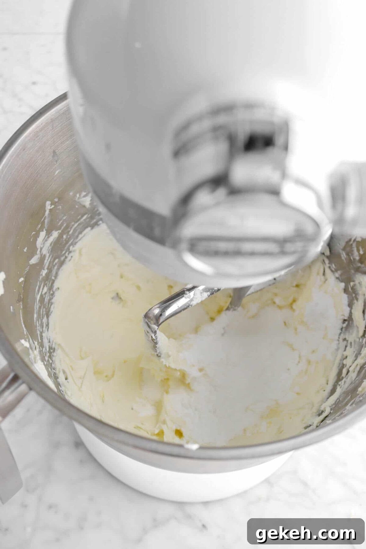 powdered sugar added to cream cheese mixture