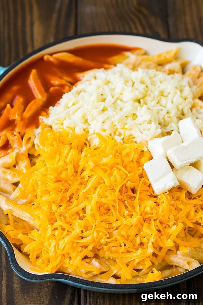 Buffalo Chicken Pasta Recipe | Baked Pasta #chicken #buffalochicken #pasta #cheese #dinner #dinneratthezoo Cooked pasta topped with three cheeses and buffalo sauce.