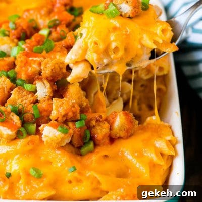 Creamy Buffalo Chicken Pasta Recipe for Spicy Weeknight Dinner 2 A spoon serving up a portion of buffalo chicken pasta.
