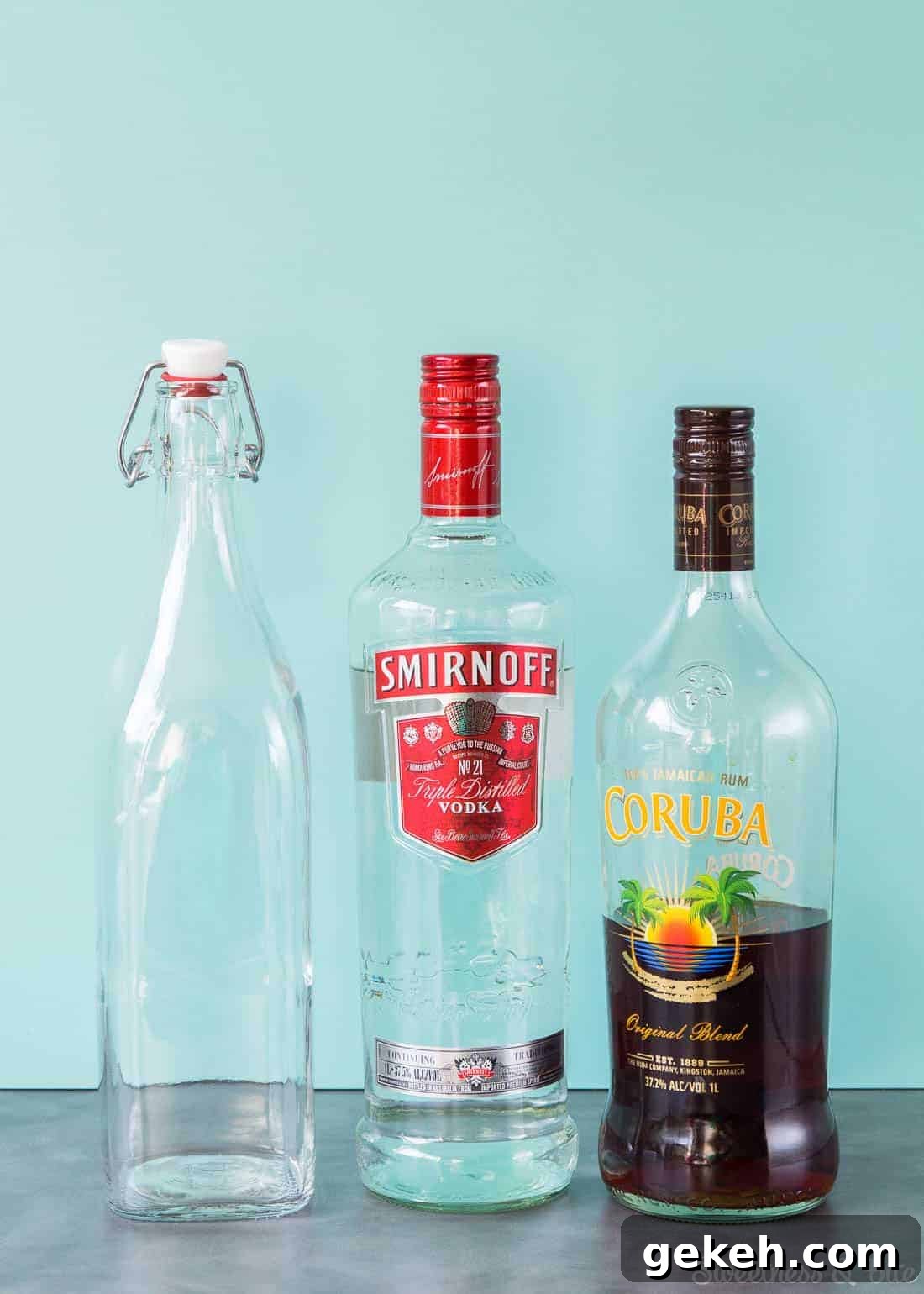 Homemade Vanilla Extract Infused with Rum: Step-by-Step Guide 3 An empty swing-top bottle, a bottle of Smirnoff vodka and a bottle of Coruba rum.