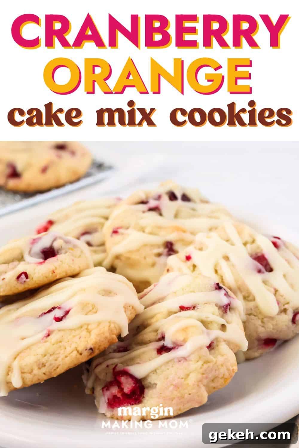 close-up view of freshly baked cranberry orange cake mix cookies on a white plate.