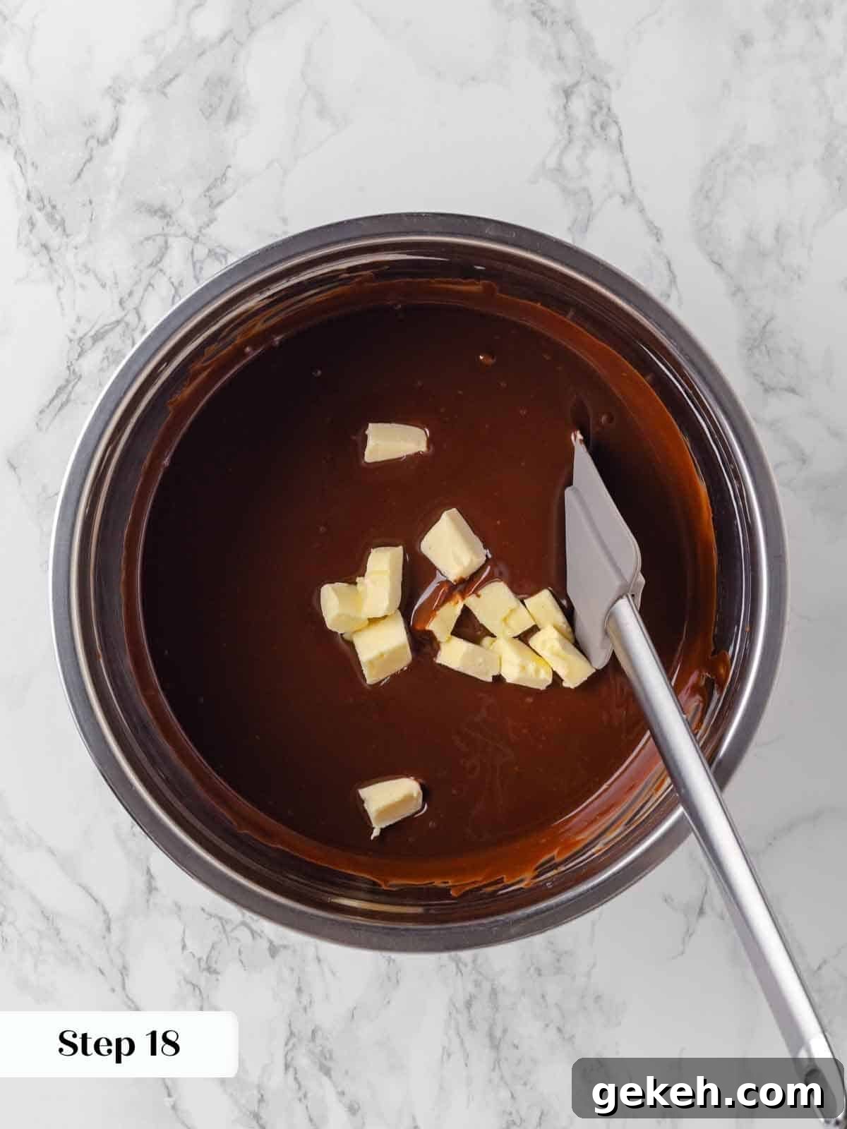 Decadent Guinness Chocolate Cake Recipe with Rich Stout Frosting 15 adding butter to hot ganache for frosting.