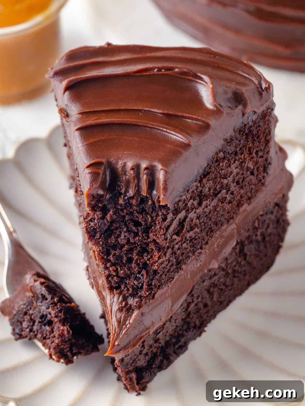 Decadent Guinness Chocolate Cake Recipe with Rich Stout Frosting 4 bite of guinness chocolate cake on fork.