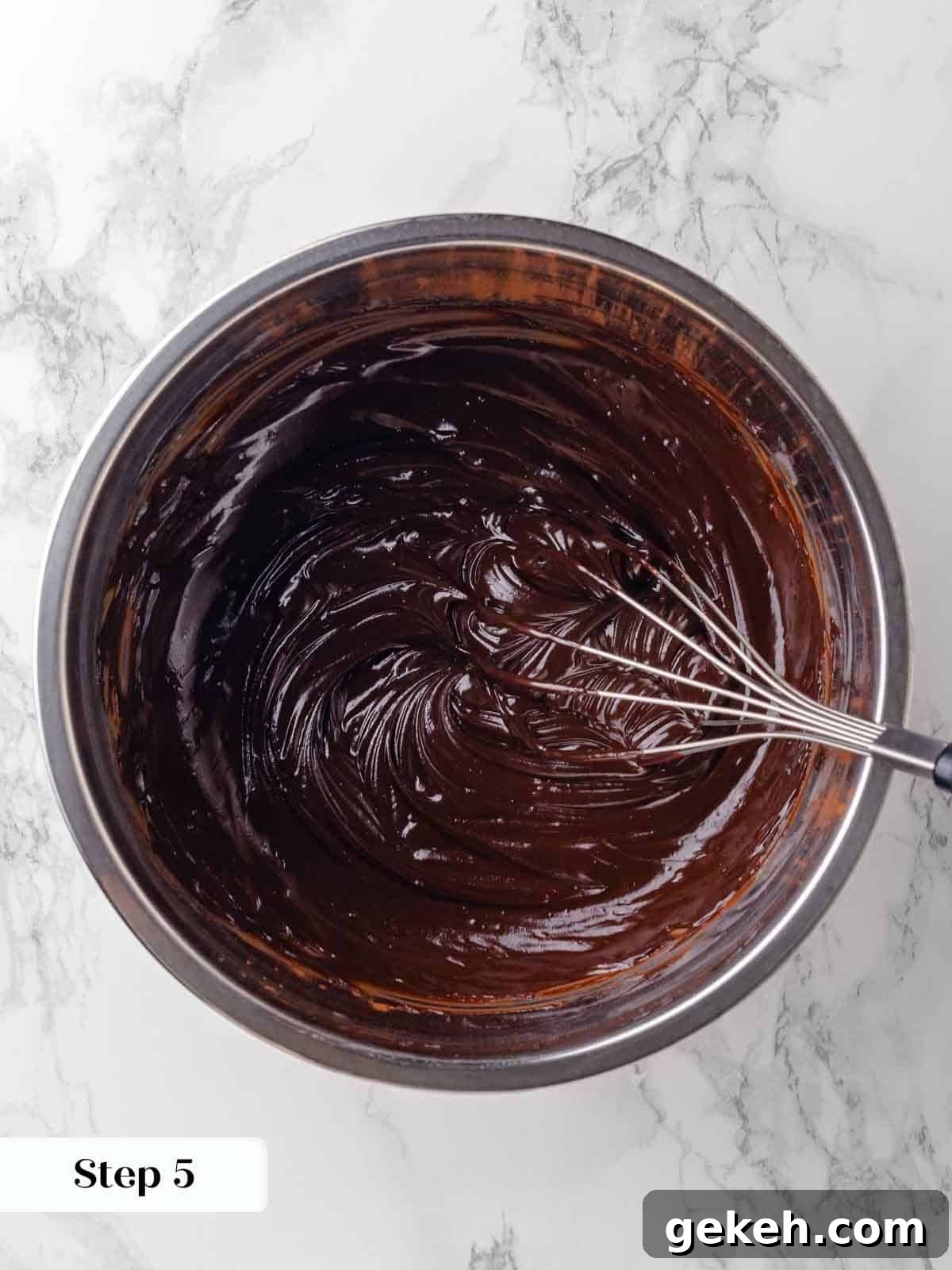 Decadent Guinness Chocolate Cake Recipe with Rich Stout Frosting 8 whisking ganache to emulsify for guinness chocolate cake batter.