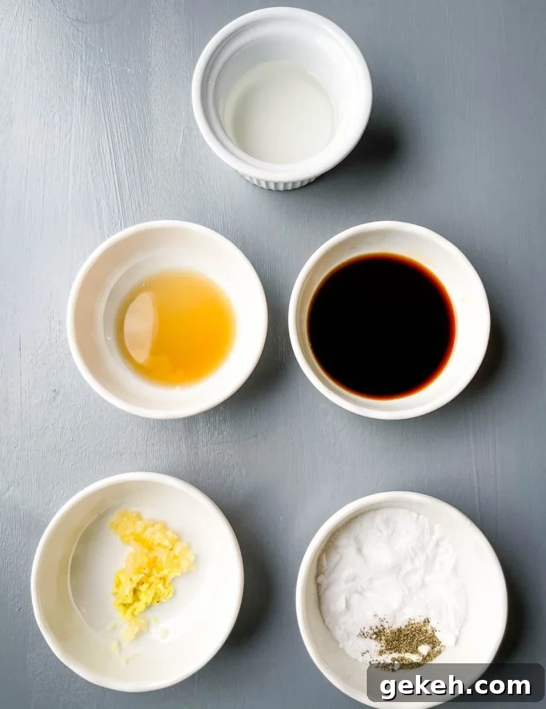 Keto Orange Chicken: Low-Carb Sticky Citrus Chicken Recipe 3 vinegar, garlic, ginger, soy sauce, sesame oil, and baking powder in separate bowls