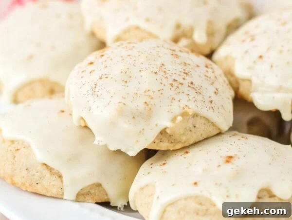 Eggnog cookies stacked on a plate.