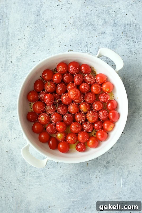 Photo of tomatoes in white baking dish before baking.