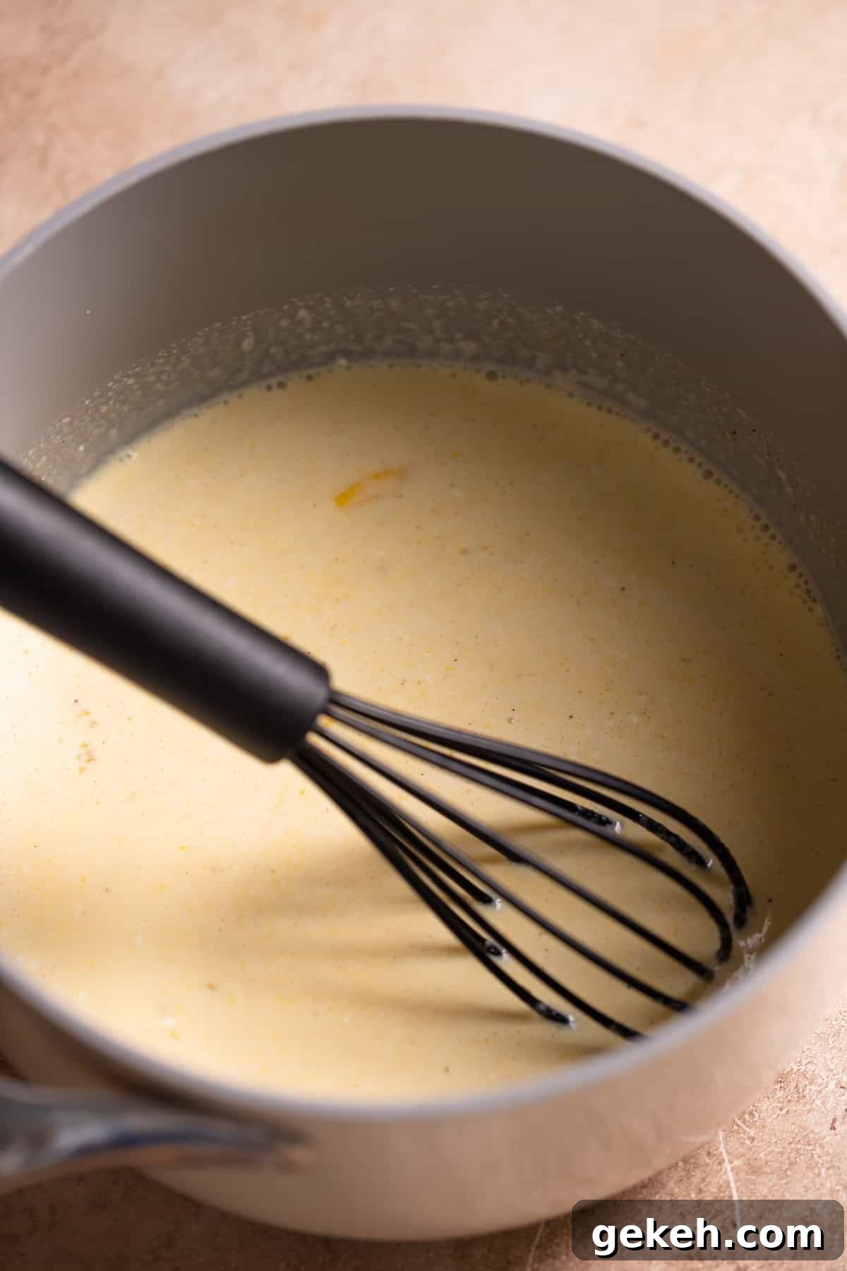 Decadent Dark Chocolate Mousse Pie Recipe for Chocolate Lovers 5 Eggs and cream being cooked together in a pot.