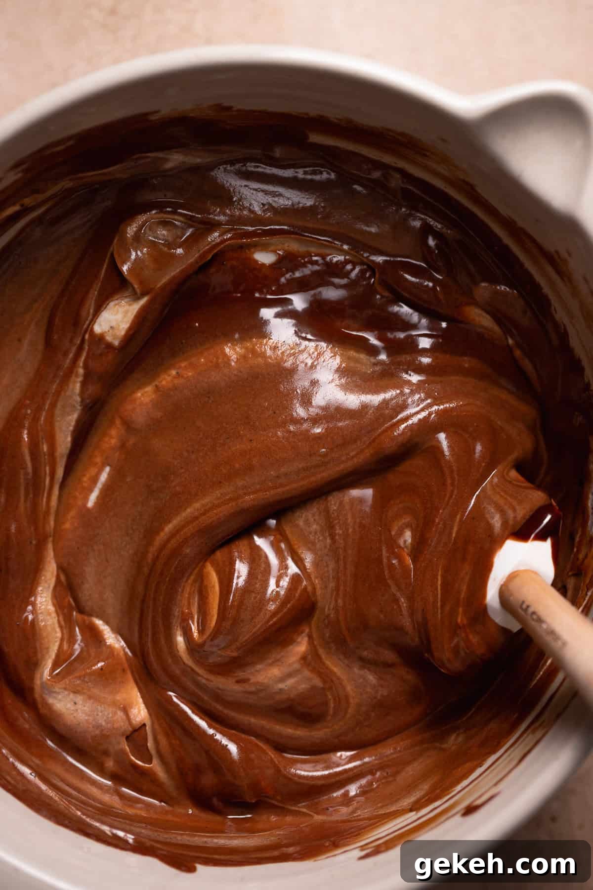 Decadent Dark Chocolate Mousse Pie Recipe for Chocolate Lovers 7 A spatula folding the ganache into the whipped cream.
