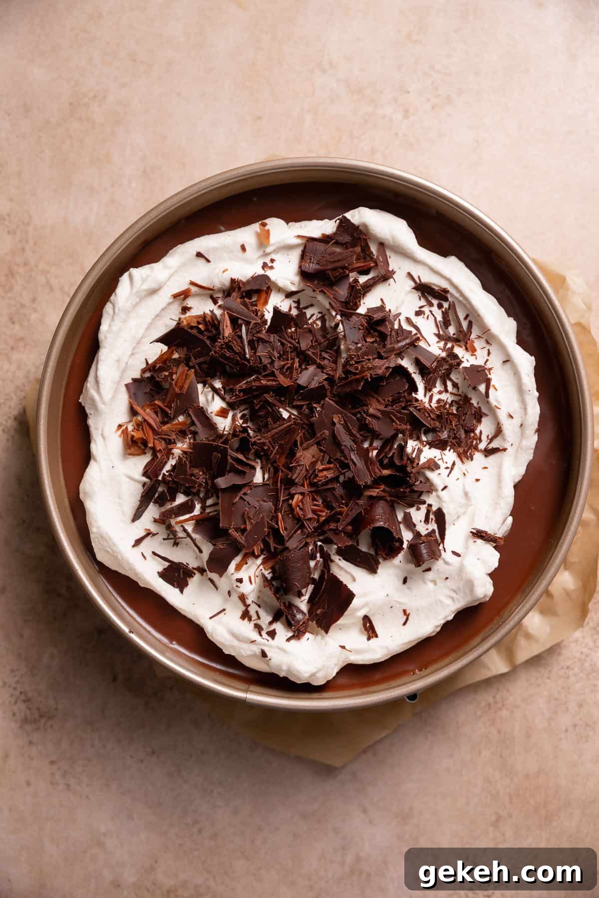 Decadent Dark Chocolate Mousse Pie Recipe for Chocolate Lovers 10 Chocolate mousse pie topped with whipped cream and chocolate curls.
