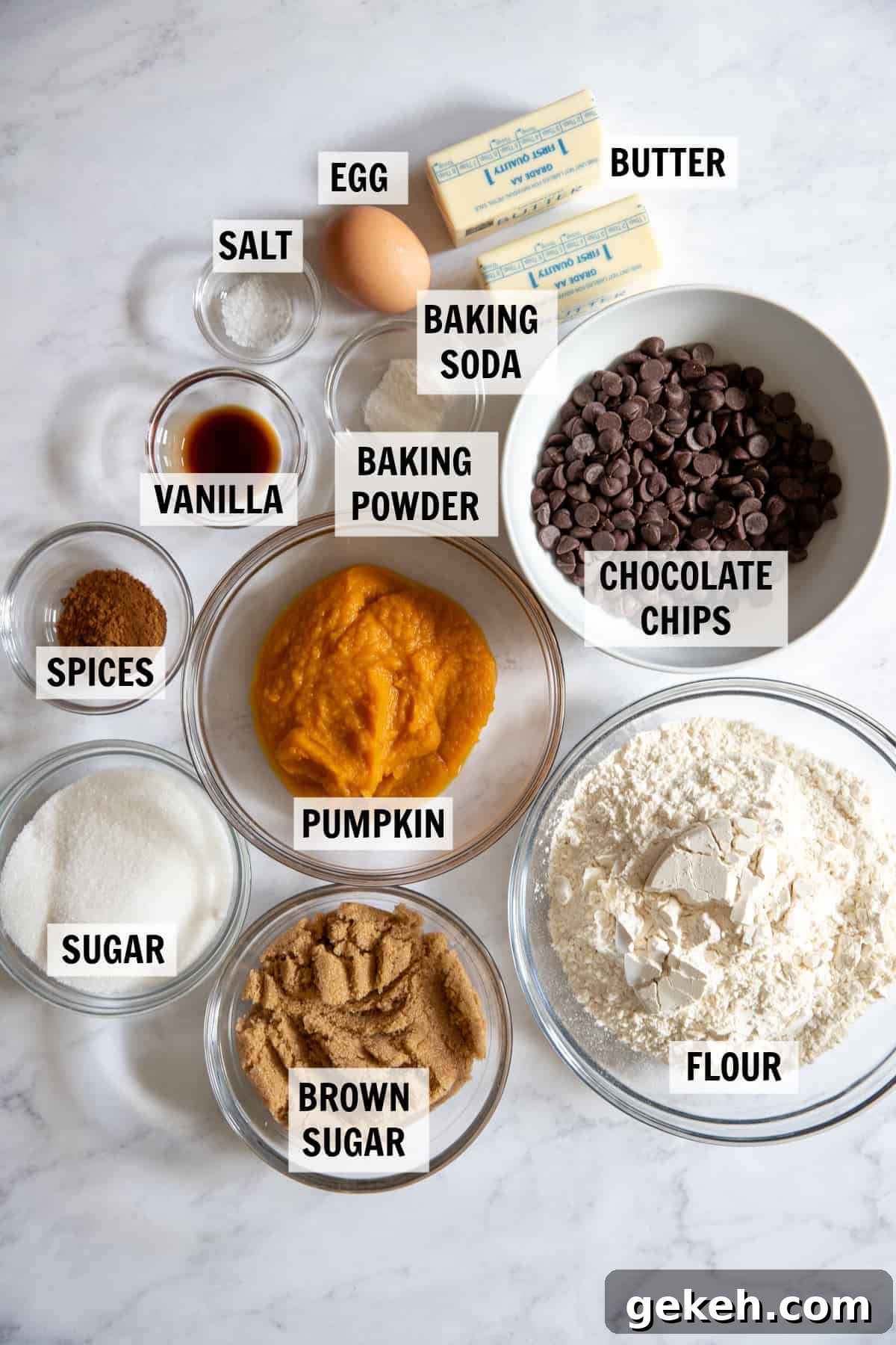 all of the ingredients for pumpkin chocolate chip cookies on a white tabletop