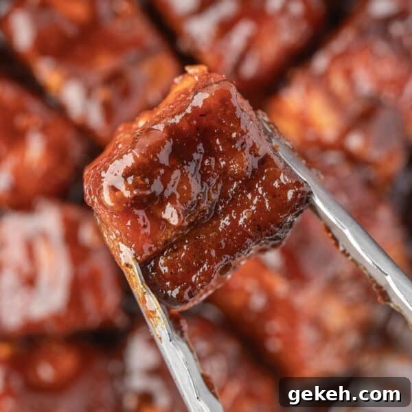 Sour Cream Cornbread Recipe: Moist Southern-Style Loaf 11 glazed, smoked pork belly cube held by tongs