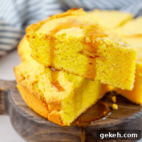 Sour Cream Cornbread Recipe: Moist Southern-Style Loaf 13 A slice of cornbread on a wooden plate