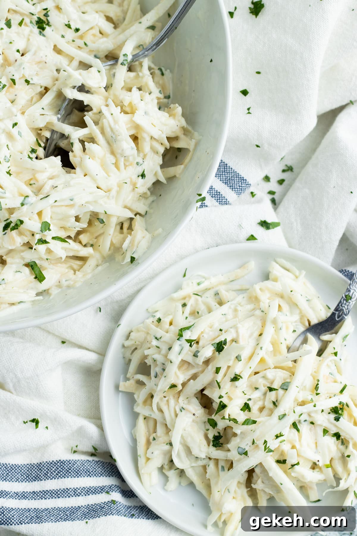 Photo of a bowl of celery root remoulade and a plate with some on it too.
