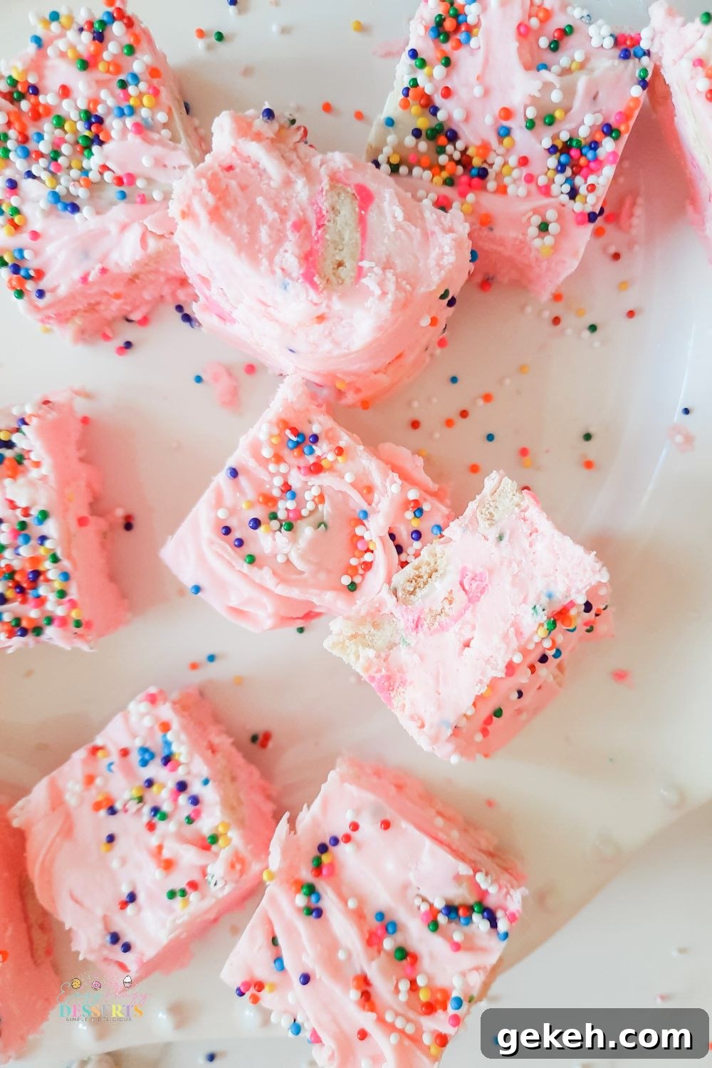 Funfetti Strawberry Fudge Recipe — Colorful No-Bake Treat 2 Over head image of a few strawberry fudge bars with sprinkles and cookies