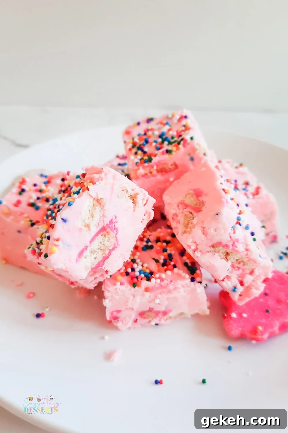 Funfetti Strawberry Fudge Recipe — Colorful No-Bake Treat 3 A few squares of funfetti fudge with strawberry frosting, sprinkled and circus cookies