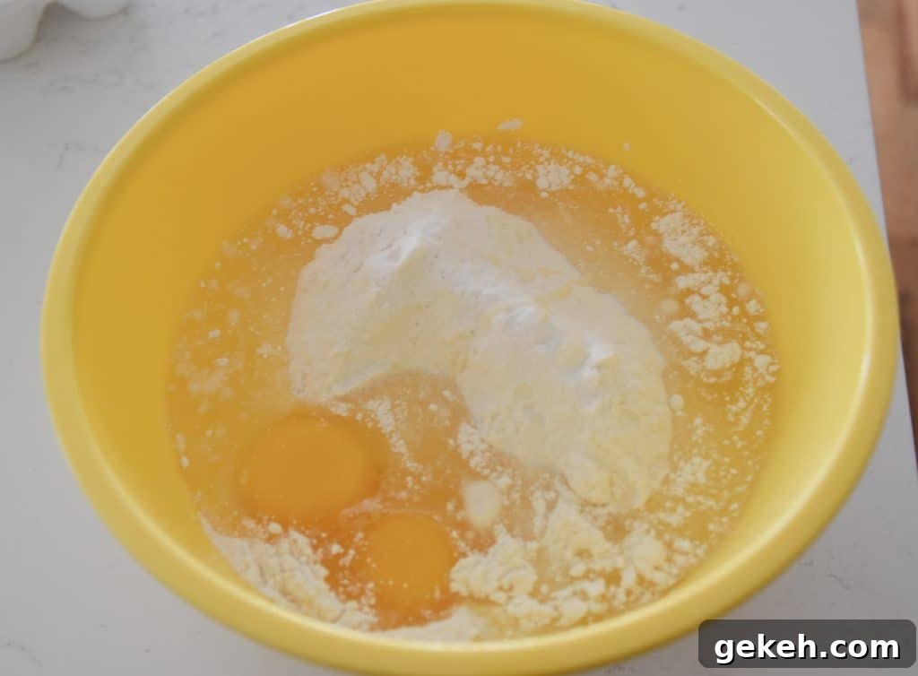 Air Fryer Chocolate Chip Cookies Made with Cake Mix 5 cake mix egg and oil in a bowl