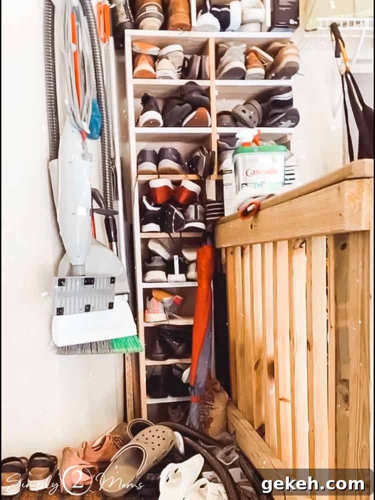 Shoe storage shelves in a garage overflowing with a family's shoes.