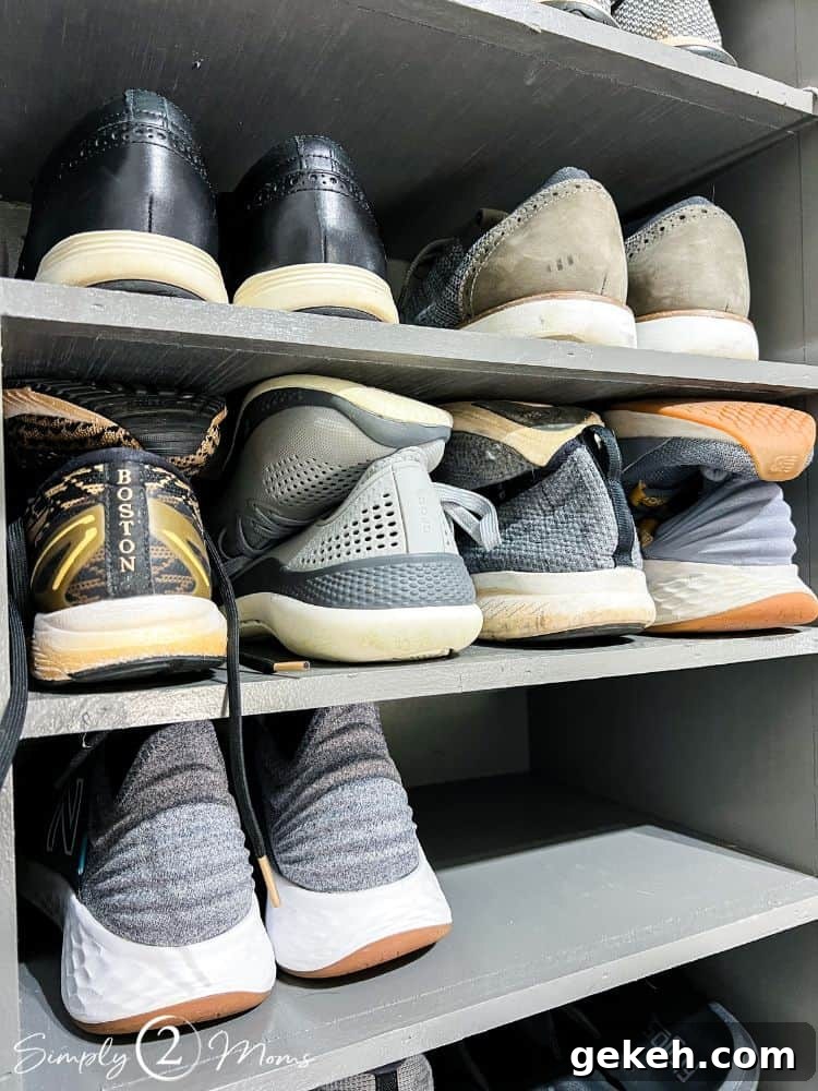 Close up of DIY shoe shelves showing how to fit four pairs of running shoes on each shelf.