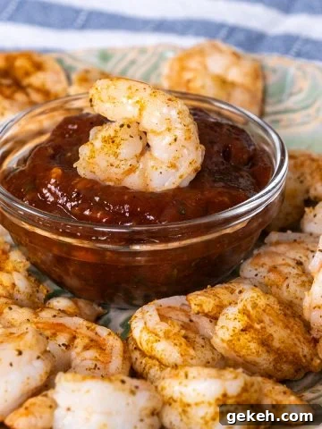 Shrimp Cocktail dipped in cocktail sauce