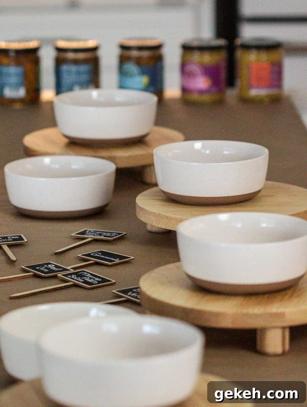 Bowls and signs for chips and salsa bar.