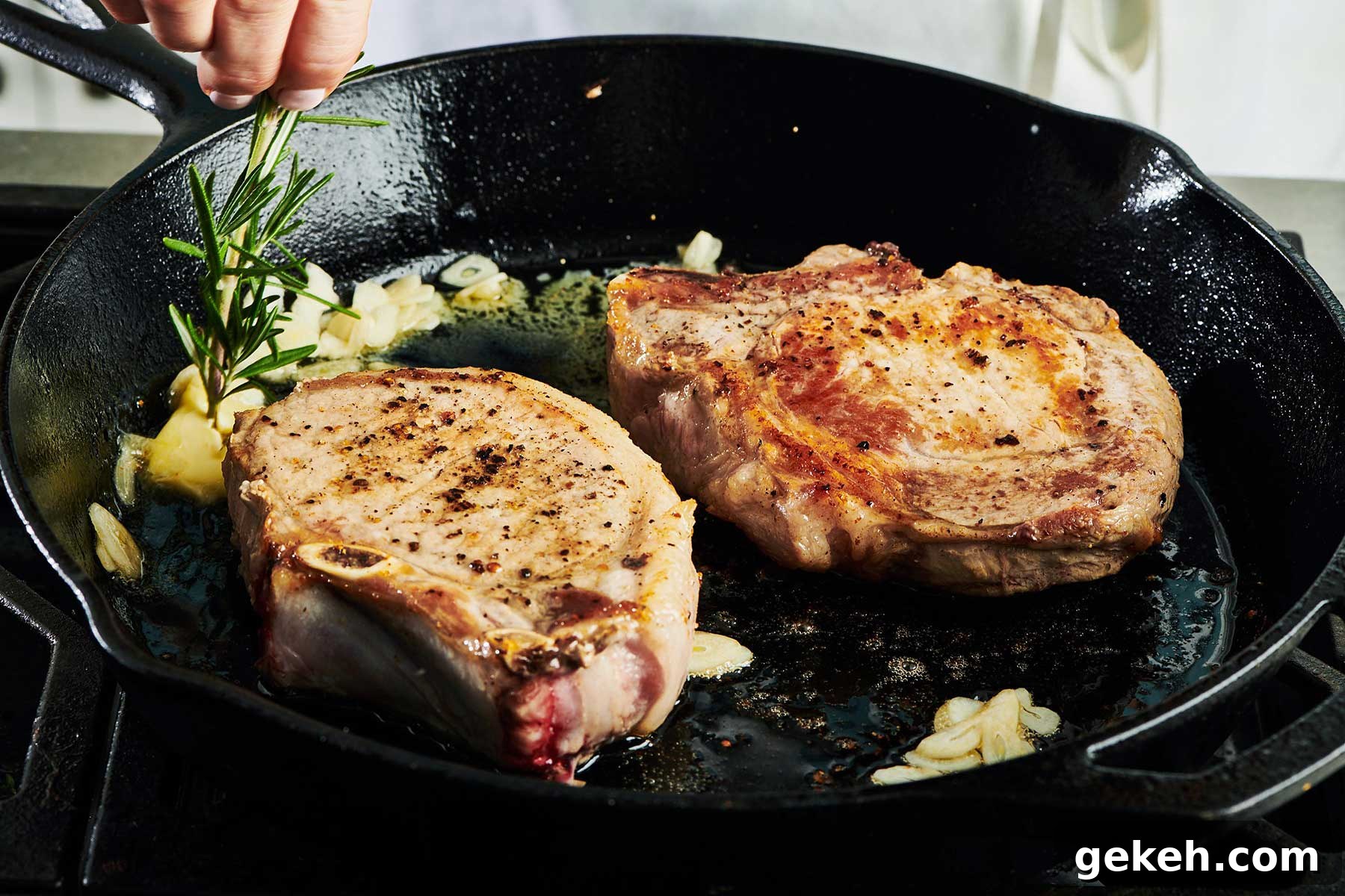 Cooking with Rosemary: Flavorful Recipes and Tips for Home Cooks 4 Adding fresh rosemary to pork chops in cast iron pan on stove.