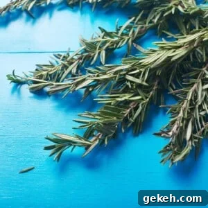 Cooking with Rosemary: Flavorful Recipes and Tips for Home Cooks 7 Bundle of fresh rosemary on blue table.