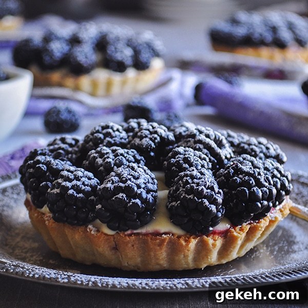 Blackberry custard fruit tarts with amaretto.