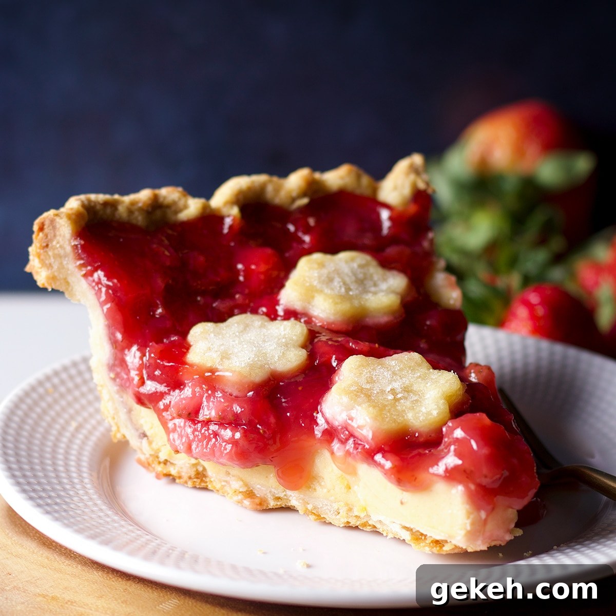 A slice of strawberry cream pie on a white plate.