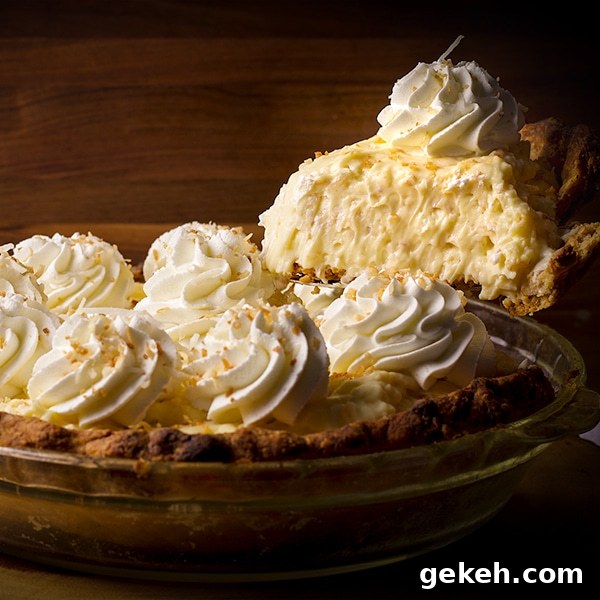 Serving a slice of coconut cream pie.