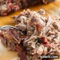 Smoked Pork Butt - Shredded on a Wooden Board with Fork