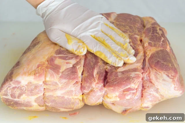 Rubbing a Boneless Pork Butt with Yellow Mustard