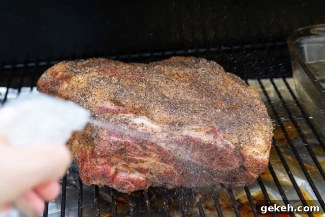 Spritzing the Meat with Water for the Best Smoked Pulled Pork Recipe