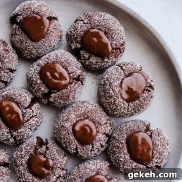 Gluten-Free Chocolate Blossom Cookies Recipe for Perfect Bakes 13 Cookies with chocolate centers on a plate.