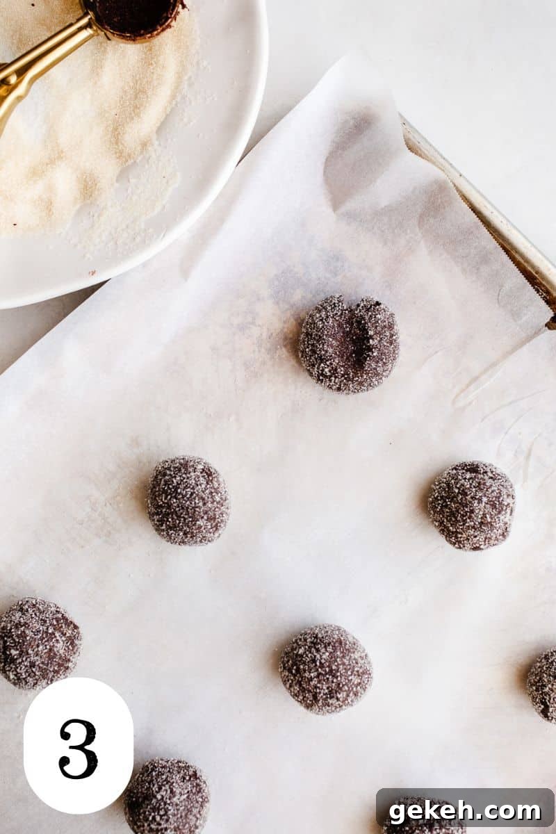 Gluten-Free Chocolate Blossom Cookies Recipe for Perfect Bakes 6 Cookie dough balls on a cookie sheet.