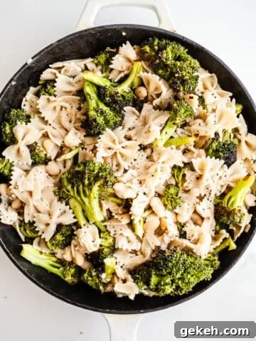 Pasta and broccoli in a skillet.