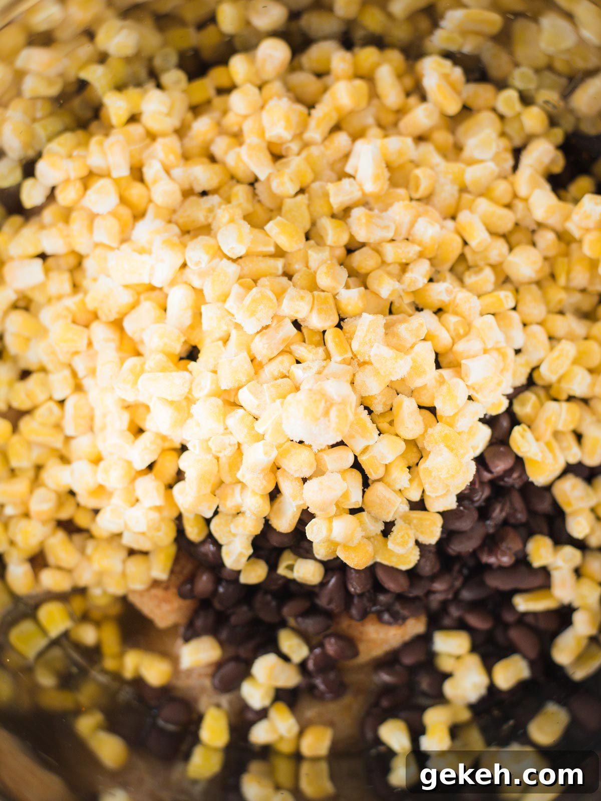 ingredients in instant pot with corn on top