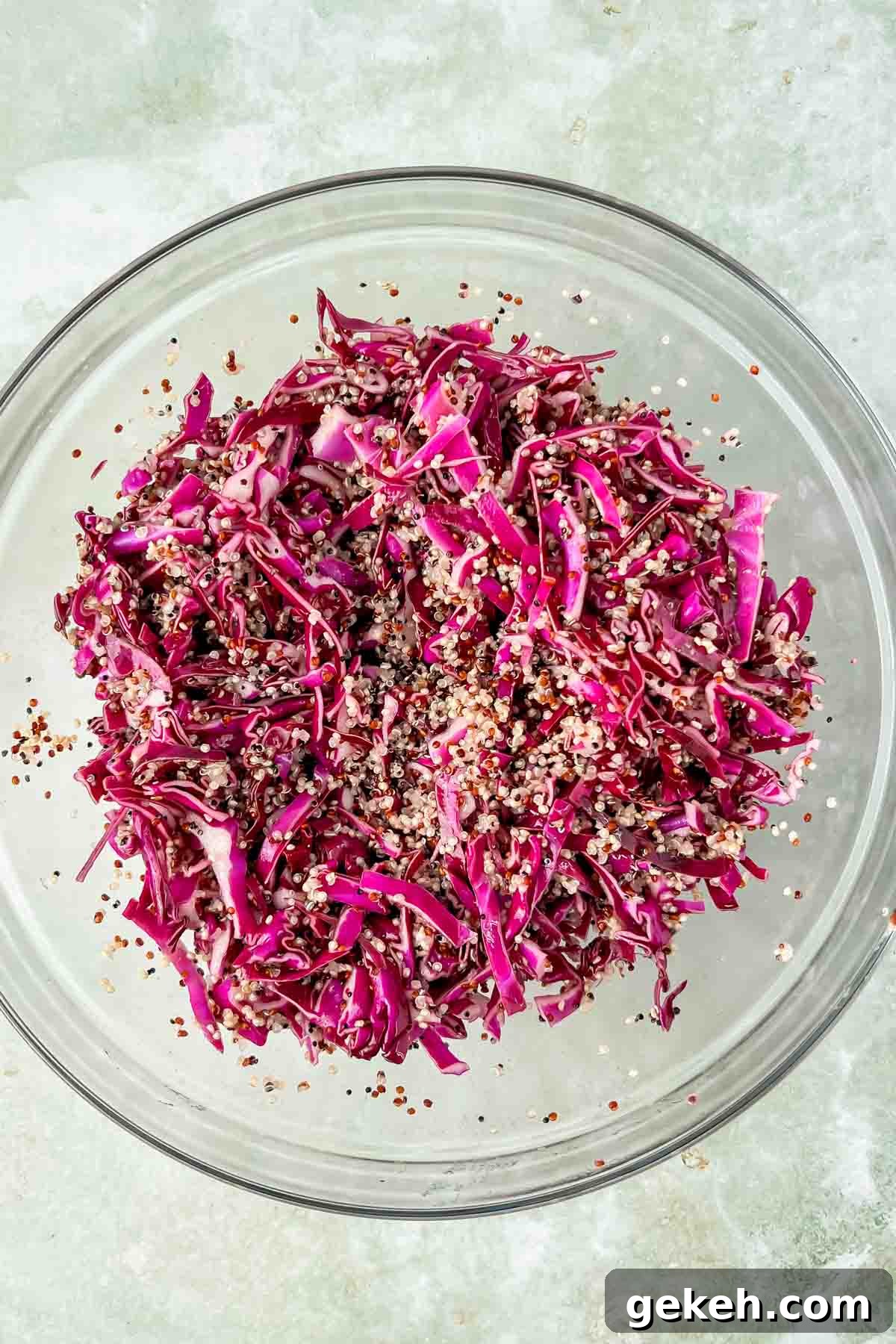 massaged purple cabbage and quinoa in large mixing bowl. 